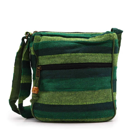 Large nepal sling bag in forest green with green stripes woven fabric and wooden toggle closure crossbody style