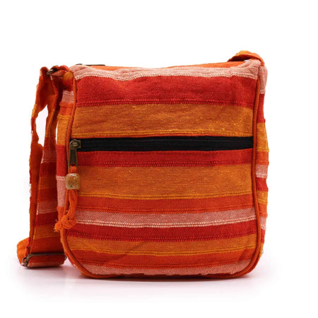 Large nepal sling bag in vibrant orange and red stripes woven fabric with black zipper pull crossbody style