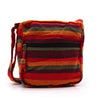 Large nepal sling bag with vibrant red orange and green striped woven fabric crossbody design