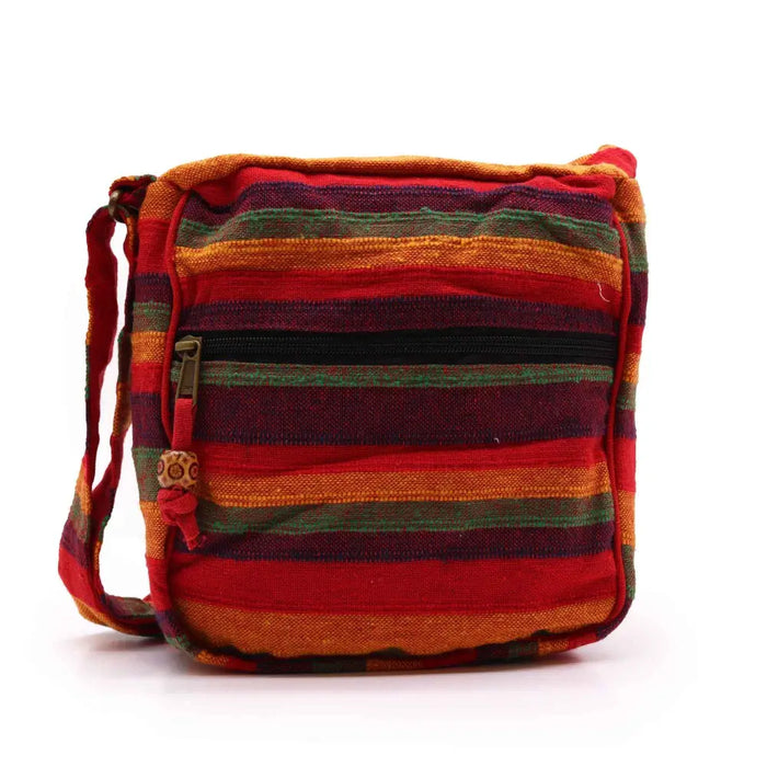 Large nepal sling bag with vibrant red orange and green striped woven fabric crossbody design