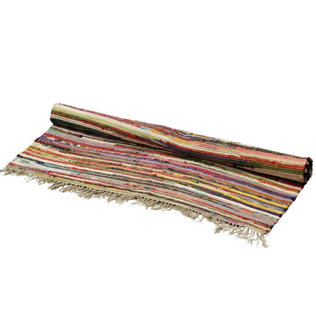 Large rag rug with random colours featuring handwoven earthy striped design and fringed edges made from fabric