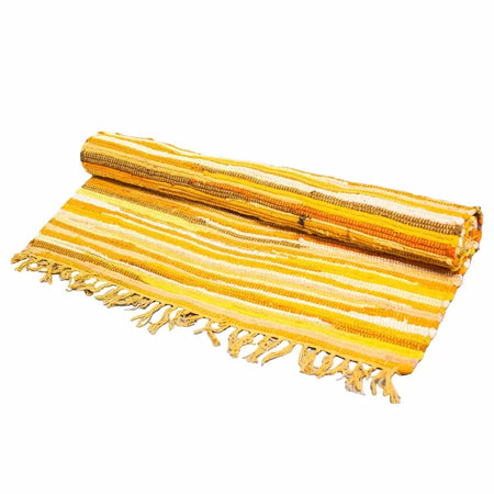 A large woven rag rug with vibrant yellow and orange sunrise oranges stripes and fringed edges