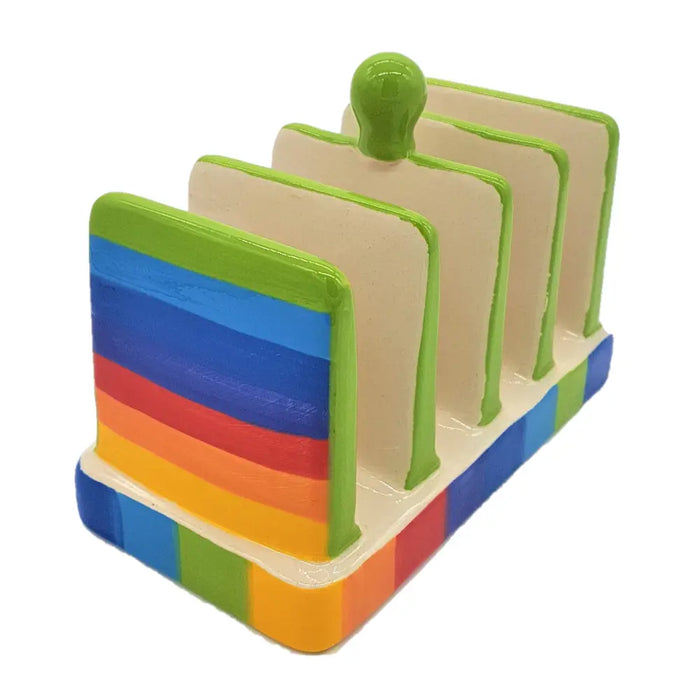 Large ceramic toast rack with vibrant rainbow stripes and a glossy green knob for holding ceramic toast slices