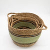 Handwoven large seagrass and cotton baskets with olive green and tan stripes and sturdy handles in a set of 3