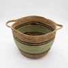Large woven seagrass and cotton basket with olive green and natural brown stripes and two handles in a set of 3 cotton baskets