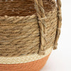 Large seagrass and straw basket set with natural and orange stripes textured woven pattern and varying diameter sizes