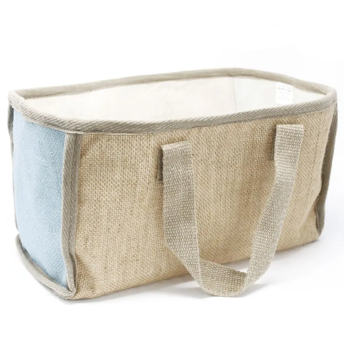 Large shopping basket made of beige and light blue woven fabric with sturdy handles for carrying and storage