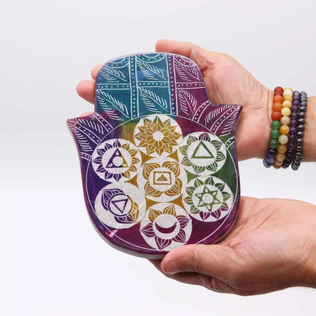 Large soapstone incense holder shaped like a colorful hamsa with chakra symbols and geometric patterns in rainbow colors