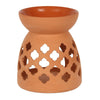 Large terracotta ceramic oil burner with intricate quatrefoil cutouts for home decor and aromatic use
