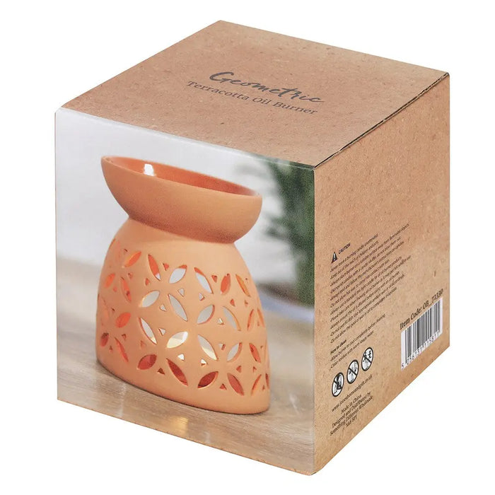 Large terracotta oil burner with intricate leaf-patterned cutouts for home decor and aromatherapy use