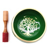 Large green singing bowl set with gold rim and engraved white tree of life design in a meditation bowl set