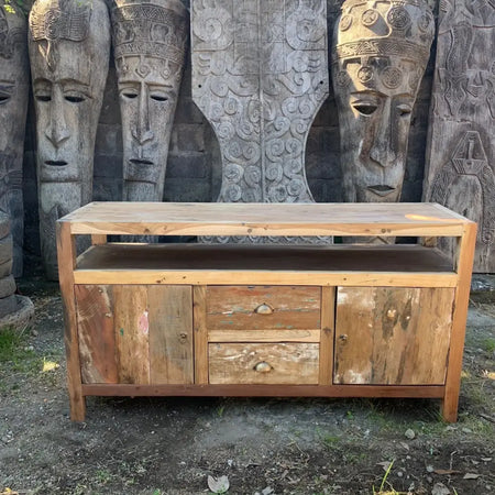 Rustic large tv stand made of weathered reclaimed wood with two drawers and round metal pulls