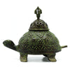 Large verdigris brass turtle-shaped incense holder with intricate geometric and floral engravings in green patina
