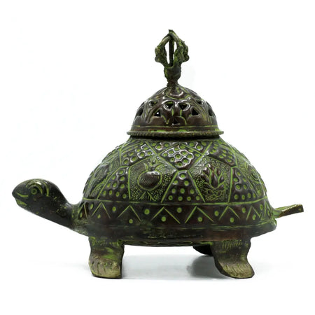 Large verdigris brass turtle-shaped incense holder with intricate geometric and floral engravings in green patina