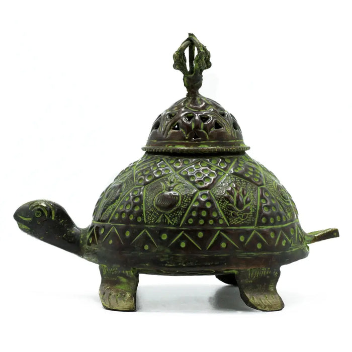 Large verdigris brass turtle-shaped incense holder with intricate geometric and floral engravings in green patina