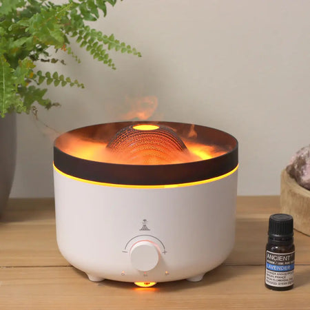 White cylindrical aroma diffuser with glowing orange rim and dark brown top featuring illuminated textured sphere