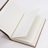 Open black leather notebook with lined off-white pages measuring 7 by 5 inches for writing and notes