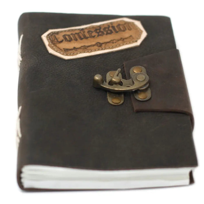 Dark brown leather notebook with brass clasp and embossed commission patch, sized 7 by 5 inches for writing and notes