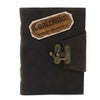 Black leather notebook with a tan stitched patch reading confession and an antique brass clasp 7 by 5 inches