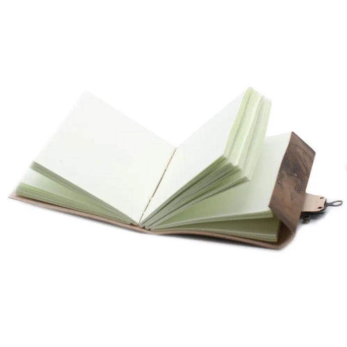 Brown leather notebook dragon with cream pages and decorative metal clasp measuring 8 by 6 inches