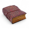 A vintage-style brown leather notebook with embossed text and deckled edges featuring aged pages and decorative stitching
