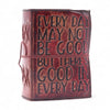 A rustic reddish brown leather notebook with embossed black lettering and a matching cord bound deckled edges design