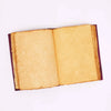 An open leather notebook with hamsa hand design featuring burgundy leather cover and aged yellowed pages