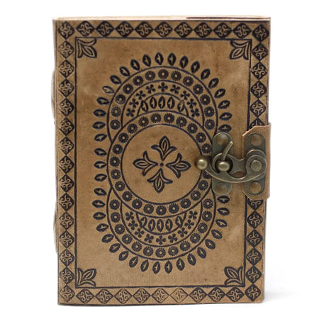 A brown leather notebook with black embossed mandala patterns and a brass latch sized 7 by 5 inches
