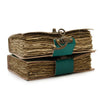 Stacked leather notebooks with vintage-style leather covers teal metal clasps and deckled edges in 7 by 5 inches size