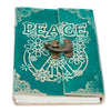 Teal leather notebook with white peace symbol and floral designs secured by a brass clasp, sized 7 by 5 inches