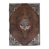 Brown leather notebook with silver embossed floral design and ornate corners measuring 10 by 7 inches