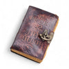 A leather notebook with a distressed brown leather cover embossed with the book of untold stories and a brass clasp