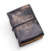 Black leather notebook with embossed silver script the stories i tell myself and a black elastic band closure