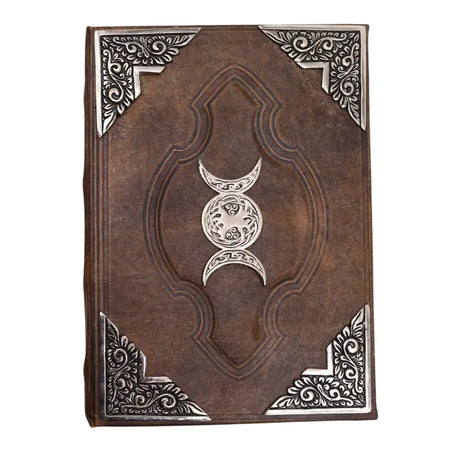 Brown leather notebook with silver embossed triple moon symbol and ornate corners sized 10 by 7 inches