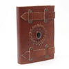 Brown leather notebook with black onyx circular gear design and metal rivets in a 6 by 4 inch leather notebook