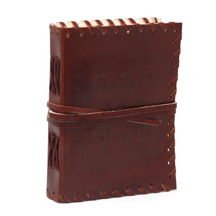 Brown leather notebook with stitched edges and embossed text measuring six by four inches for writing thoughts