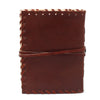 Brown leather notebook with visible stitching and wrap strap sized 6 by 4 for jotting down thoughts