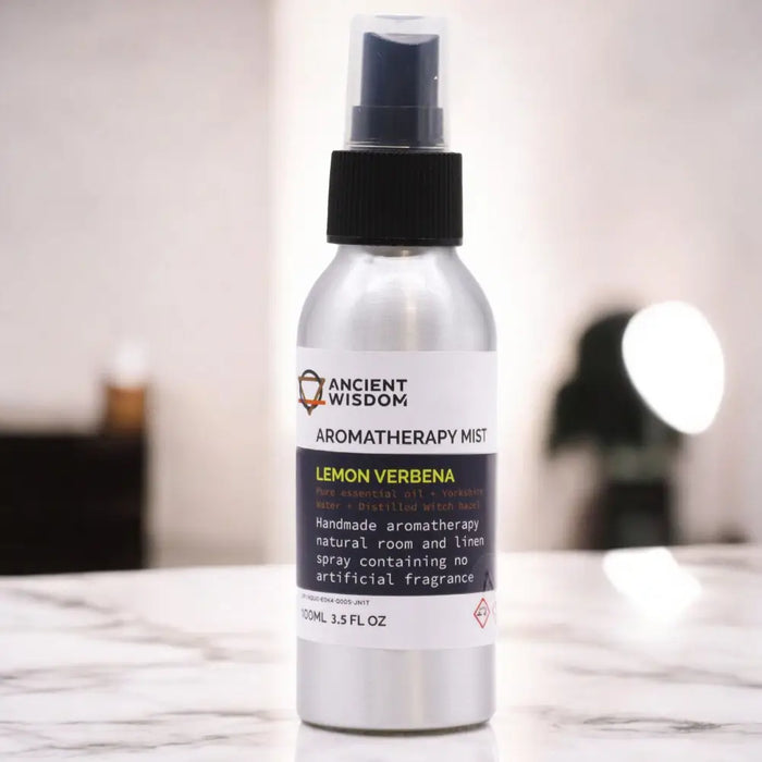 Silver aluminum spray bottle with black cap labeled ancient wisdom aromatherapy mist lemon verbena essential oil
