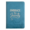 Light blue velvet notebook with teal textured cover and embrace the journey print featuring a compass design