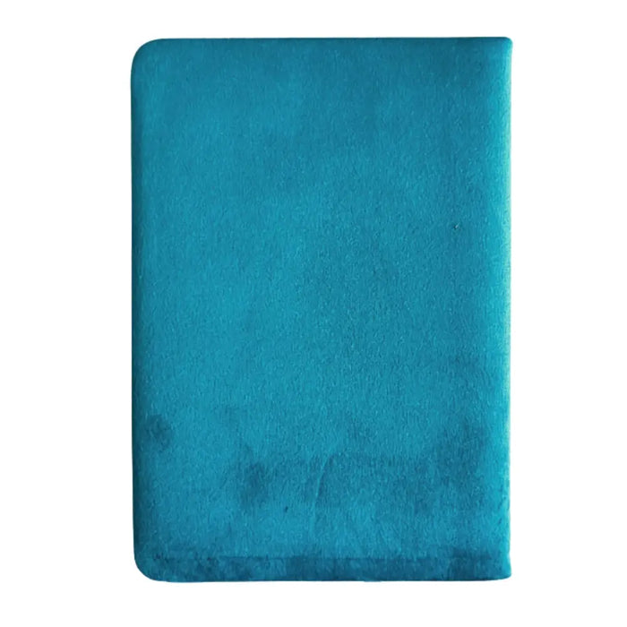 A light blue velvet notebook with a soft suede-like teal rectangular cushion on the cover with 80 pages