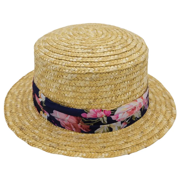 A light straw boater style hat with a wide brim and a pink white navy floral ribbon band