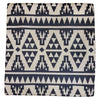 A lightly padded standard cushion cover with a navy and cream aztec geometric tribal-inspired pattern