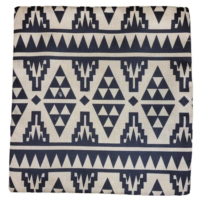 A lightly padded standard cushion cover with a navy and cream aztec geometric tribal-inspired pattern