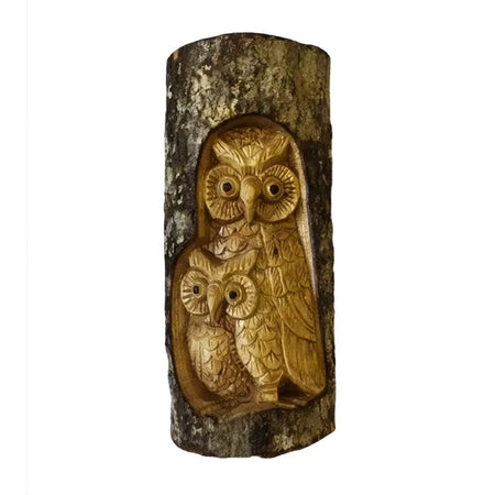 Hand carved wooden log carving of an owl family with two detailed owls nestled in a rustic tree trunk wall decor
