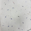 White lokta craft paper with delicate blue and pink cornflower petals embedded for gift wrapping and lokta paper projects