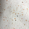 White textured lokta paper with embedded orange marigold petals for gift wrapping in a set of five sheets