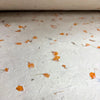 White lokta paper with embedded orange marigold petals for gift wrapping and craft projects