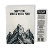 A black-and-white lokta paper notebook with mountain design and text every peak starts with a plan on the cover