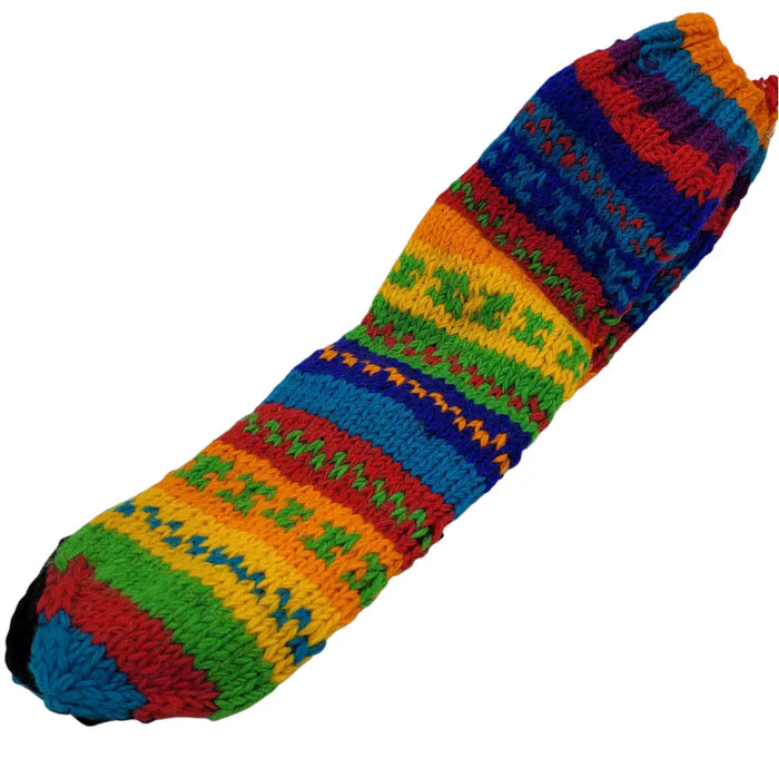 Long 100% wool slipper sock with bold rainbow stripes and textured patterns in red orange yellow green blue and purple