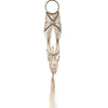 Beige long macrame pot holder with rattan hoop top and tassel bottom made of woven cotton for hanging plants